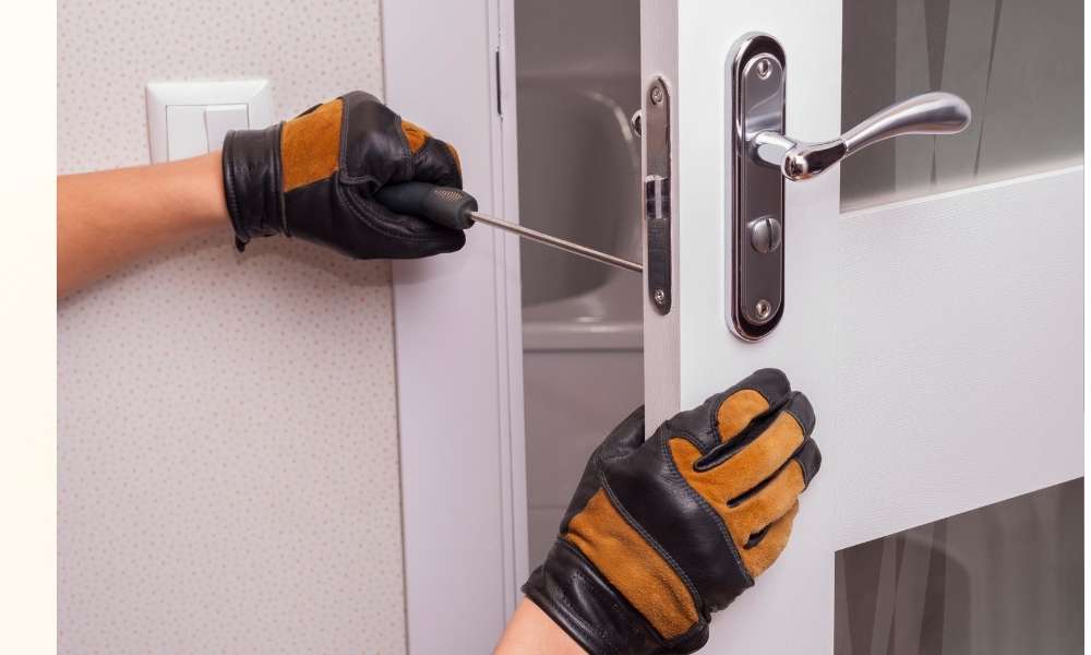 Use a small screwdriver or thin tool on interior doors